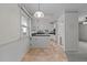 Charming kitchen featuring classic white cabinetry, contrasting countertops, and a bright window above the sink at 1837 Shamrock Dr, Burlington, NC 27215