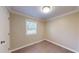 Bedroom features hardwood flooring, one window for natural light, and neutral paint at 206 Justice Heights St, Apex, NC 27502