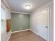 The bedroom has wood-look floors, neutral and green walls, and a mounted shelf at 206 Justice Heights St, Apex, NC 27502