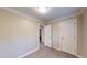 Bedroom features hardwood flooring, neutral paint, and white doors and trim at 206 Justice Heights St, Apex, NC 27502