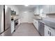 Bright eat-in kitchen features modern stainless steel appliances and granite countertops at 206 Justice Heights St, Apex, NC 27502