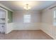 Living room with chair rail, natural light, and hardwood flooring throughout at 206 Justice Heights St, Apex, NC 27502