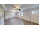 Living room with natural light, ceiling fan, and white wainscoting along the walls at 206 Justice Heights St, Apex, NC 27502