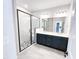 Elegant bathroom featuring a glass shower, tile flooring, and a double sink vanity at 2335 Whitewing Ln, Wendell, NC 27591