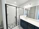 Modern primary bathroom with tiled shower and double sink vanity at 2335 Whitewing Ln, Wendell, NC 27591