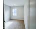 Bedroom with window and carpet flooring at 2335 Whitewing Ln, Wendell, NC 27591