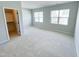 Spacious bedroom with carpet, ample natural light, and a walk-in closet at 2335 Whitewing Ln, Wendell, NC 27591