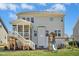 Beautiful home backyard with a screened-in porch and an outdoor playset at 26 Stone Bridge Xing, Chapel Hill, NC 27517