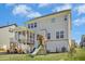 Spacious backyard with a screened-in porch, wooden playset and lush green lawn at 26 Stone Bridge Xing, Chapel Hill, NC 27517
