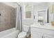 Bathroom with shower-tub combo with decorative tile and white cabinets at 26 Stone Bridge Xing, Chapel Hill, NC 27517