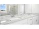 Bathroom featuring a double sink vanity with white cabinets and granite counters at 26 Stone Bridge Xing, Chapel Hill, NC 27517