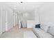 Bonus room featuring a gray sofa and plush carpeting at 26 Stone Bridge Xing, Chapel Hill, NC 27517