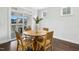 Cozy breakfast nook with a round table, four chairs, and sliding door access to a patio at 26 Stone Bridge Xing, Chapel Hill, NC 27517