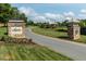 Community entrance featuring the Legacy sign with manicured landscaping at 26 Stone Bridge Xing, Chapel Hill, NC 27517
