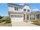 Charming two-story home featuring a two-car garage and covered front porch at 26 Stone Bridge Xing, Chapel Hill, NC 27517