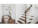 Hallway with stairs and wood flooring at 26 Stone Bridge Xing, Chapel Hill, NC 27517