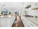 Bright, open kitchen with granite countertops, stainless appliances and hardwood flooring at 26 Stone Bridge Xing, Chapel Hill, NC 27517