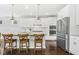 Spacious kitchen with white cabinets, stainless steel appliances, and large island at 26 Stone Bridge Xing, Chapel Hill, NC 27517