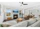 Comfortable living room with a fireplace, a large window, and plenty of seating at 26 Stone Bridge Xing, Chapel Hill, NC 27517