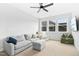 Living room featuring a gray sofa and ceiling fan at 26 Stone Bridge Xing, Chapel Hill, NC 27517