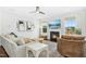 Inviting living room featuring a fireplace, large windows, and comfortable seating at 26 Stone Bridge Xing, Chapel Hill, NC 27517