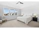 Bright main bedroom with large windows and plush carpeting at 26 Stone Bridge Xing, Chapel Hill, NC 27517