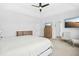 Spacious main bedroom with a ceiling fan, TV, sitting area, and ensuite bathroom at 26 Stone Bridge Xing, Chapel Hill, NC 27517