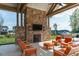 Inviting outdoor fireplace with stone surround creates a cozy gathering spot for residents at 26 Stone Bridge Xing, Chapel Hill, NC 27517