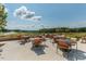 Community patio with tables overlooking views of golf course and neighborhood at 26 Stone Bridge Xing, Chapel Hill, NC 27517