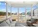 Screened porch featuring wicker furniture and a backyard view at 26 Stone Bridge Xing, Chapel Hill, NC 27517