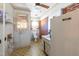 Practical laundry room with vintage appliances and brick accents at 2608 Walley St, Rocky Mount, NC 27803