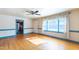 Bright living room featuring hardwood floors, two windows and baseboard trim at 2608 Walley St, Rocky Mount, NC 27803