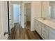 Well-lit bathroom with a vanity, storage and neutral finishes at 338 Tormore Dr, Homesite 123, Sanford, NC 27330