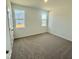Comfortable bedroom with two windows providing views of the outdoors and plenty of light at 338 Tormore Dr, Homesite 123, Sanford, NC 27330
