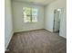 Cozy bedroom with neutral carpet and a large window offering ample natural light at 338 Tormore Dr, Homesite 123, Sanford, NC 27330