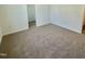 Spacious bedroom with neutral carpet and easy access to storage at 338 Tormore Dr, Homesite 123, Sanford, NC 27330