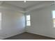 Bright main bedroom with tray ceiling, neutral carpet, and bright windows providing natural light at 338 Tormore Dr, Homesite 123, Sanford, NC 27330