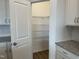 Spacious walk-in pantry featuring metal shelving and plenty of room for organized storage at 338 Tormore Dr, Homesite 123, Sanford, NC 27330