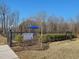 Dog park with seating area and posted rules, creating a welcoming space for pets and owners at 353 Church St # 63, Wendell, NC 27591