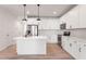 Spacious kitchen featuring stainless steel appliances, white cabinets, and a central island at 357 Church St # 61, Wendell, NC 27591
