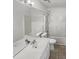 Well-lit bathroom featuring a white vanity, a large mirror, and a shower-tub combination at 3908 Sturbridge Dr, Durham, NC 27713