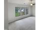 Bedroom featuring large windows that let in natural light with a view of the green outdoor scenery at 3908 Sturbridge Dr, Durham, NC 27713
