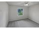 Bare bedroom featuring a ceiling fan and a window at 3908 Sturbridge Dr, Durham, NC 27713