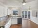 Bright kitchen with white cabinets and stainless steel appliances at 3908 Sturbridge Dr, Durham, NC 27713