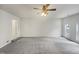 Spacious living room featuring a ceiling fan, neutral paint, and carpet flooring at 3908 Sturbridge Dr, Durham, NC 27713