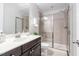 Modern bathroom featuring a sleek vanity, mirrored shower doors, and elegant fixtures at 3924 Overcup Oak Ln, Cary, NC 27519