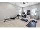 Workout area with fitness equipment, carpeted floor, and natural lighting at 3924 Overcup Oak Ln, Cary, NC 27519