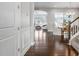 Inviting foyer featuring gleaming hardwood floors, elegant wainscoting, and an arched entryway at 3924 Overcup Oak Ln, Cary, NC 27519