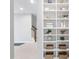 Hallway with carpet, white shelving, and a view of the stairs with dark wood railing at 3924 Overcup Oak Ln, Cary, NC 27519