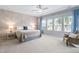 Serene primary bedroom offers plenty of natural light, and a calming color palette at 3924 Overcup Oak Ln, Cary, NC 27519